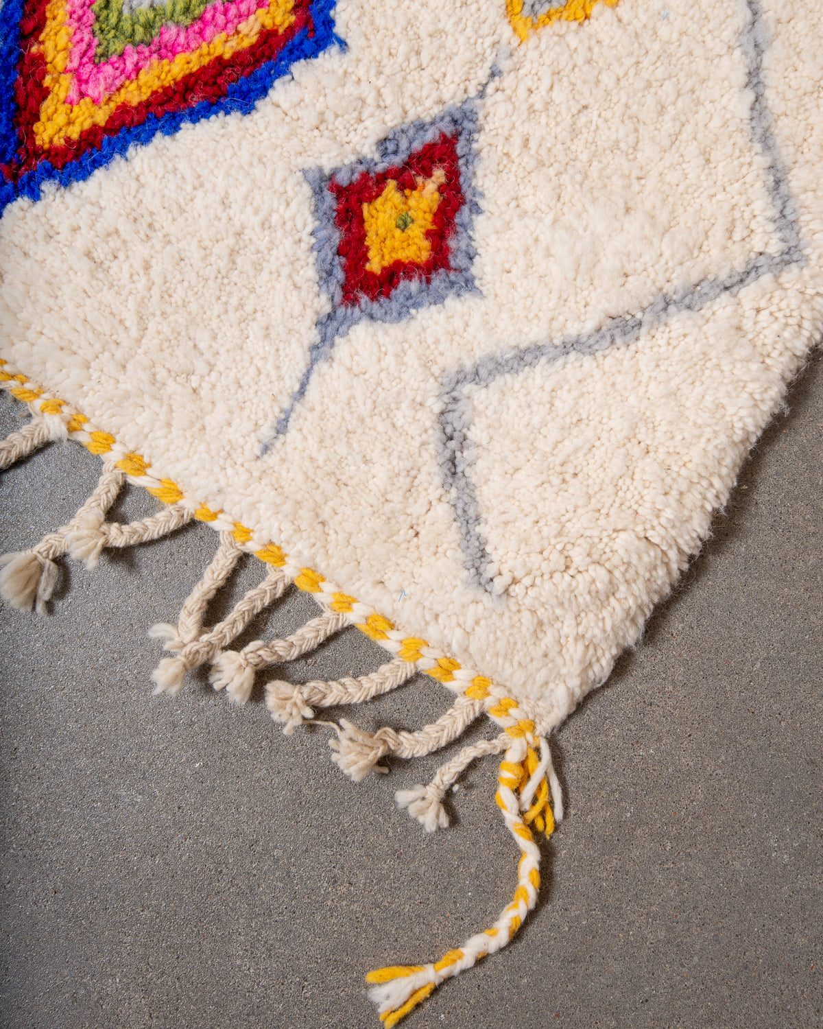 Modern, designer, handcrafted Berber rug from Morocco. Beniourain carpet with beautiful colours and patterns and fluffy wool texture.